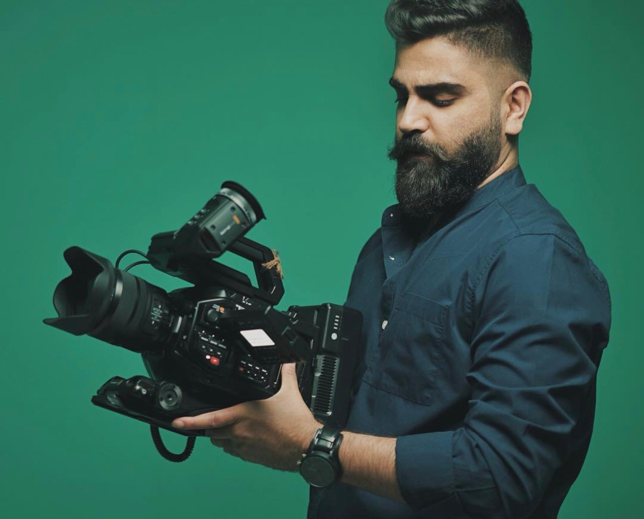 Aiman Alwaeli holding a cinema camera